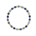 Bracelet with blue and gold beads on a white background